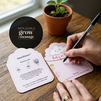 Seed Bloom onesie seed paper with Baby in Bloom design - interactive write, share, and grow message card with planting guide and pen
