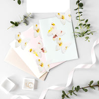 Plantable butterfly wedding favors in yellow β biodegradable paper by Seed Bloom Gifts.