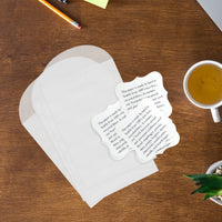Glassine envelopes with plantable seed paper cards by Seed Bloom Gifts displayed on a table