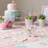 Pink baby carriage seed paper baby shower favor by Seed Bloom Gifts with a cake and decorative items in the background