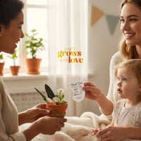 Two women and a child holding a potted plant with a 'Thank You' card in a home setting and another woman holding a Baby footprint seed paper baby shower favor by Seed Bloom Gifts.