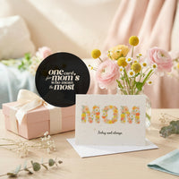 A collection of colorful Mother's Day cards, featuring floral designs and heartfelt messages for celebrating moms