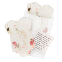 Bloom Plantable Seed Paper Baby Shower Kit onesies with pressed pink flowers in tissue wrapping and seed information tag