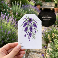Floral Gift Tag Blooms - bulk set of seed paper gift tags with watercolor purple lavender botanical design, personalization fields for 'To' and 'From,' showing stacked inventory and individual tags with embedded wildflower seeds on cream cardstock