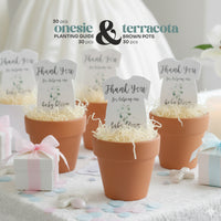 Staged photo of five terracotta pots holding gender neutral green onesie plantable seed paper by Seed Bloom Gifts favors and planting guide
