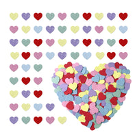 Colorful heart-shaped confetti on a white background