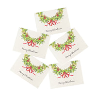 Set of five Christmas-themed coasters with wreaths and ribbons on a white background