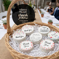 A basket made of wicker containing assorted thank you cards with "Bloom Thank You Tags" attached