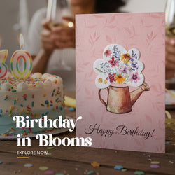 Set of four plantable Happy Birthday cards featuring a watering can and bouquet of wildflowers design in various colors, packaged with brown kraft envelopes by Seed Bloom Gifts