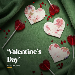 Plantable seed paper Valentine's Day heart favor embedded with colorful pink and red dried flower petals and yellow pigment, showing the textured surface by Seed Bloom Gifts