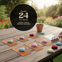 24-piece plantable heart seed paper gift set arranged on a wooden table with cards, adhesive dots, and colorful seed paper hearts