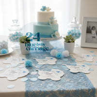 Decorative table setting with a cake and 24 pcs blue baby carriage seed paper products by Seed Bloom Gifts on a lace runner.