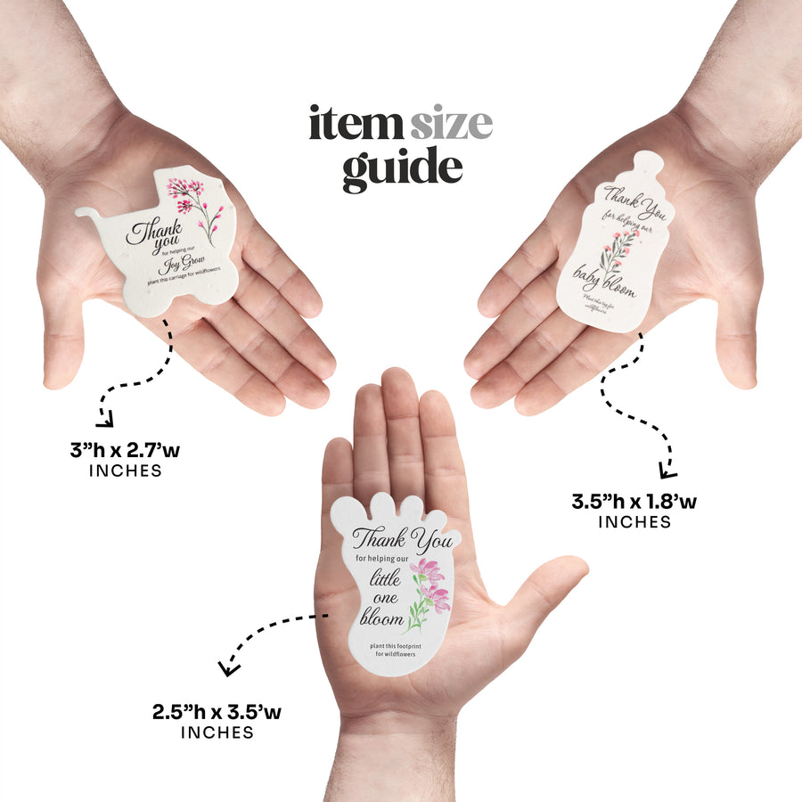 Size guide showing three different sizes of baby carriage, baby bottle, baby footprint seed paper baby shower favor by Seed Bloom Gifts held in hands with measurements provided