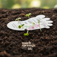 Baby footprint seed paper baby shower favor by Seed Bloom Gifts with planted seeds on a soil background, featuring a message.