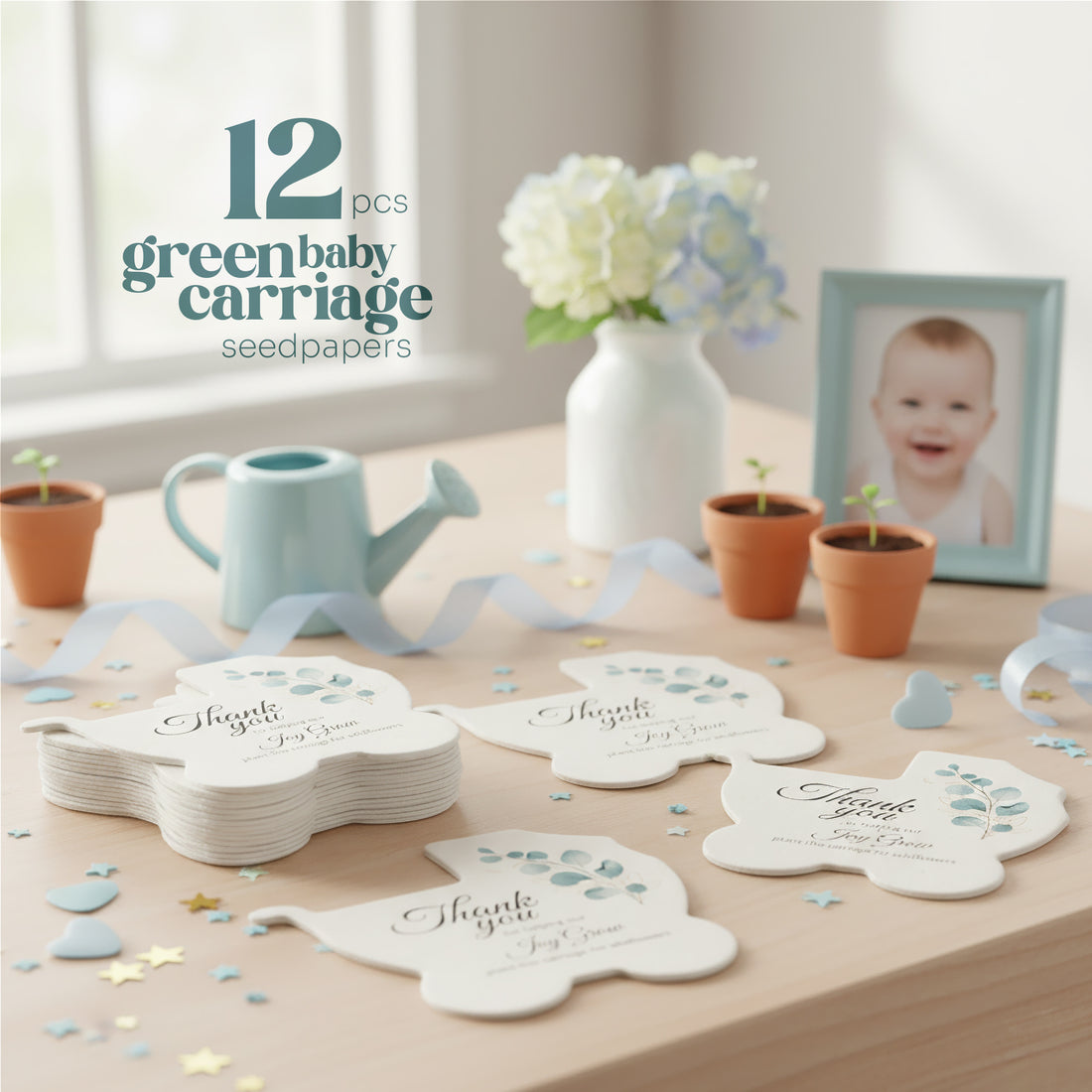 Set of baby carriage seed paper baby shower favor by Seed Bloom Gifts with floral designs on a wooden table with decorative items and picture frame of a baby