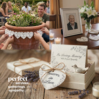 Memorial items including a potted plant, photo frame, and sympathy cards on a wooden table by Seed Bloom Gifts