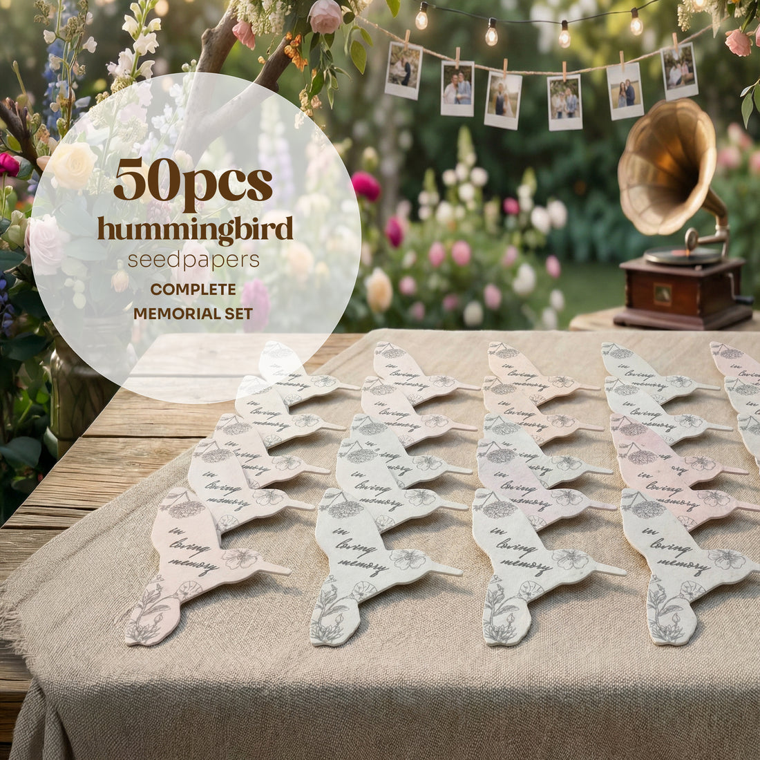 Hummingbird seed paper packets on a table with a garden and vintage gramophone in the background by Seed Bloom Gifts