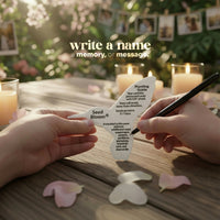 Person writing on a white seed packet with candles and flowers in the background by Seed Bloom Gifts