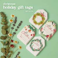 Studio image of Christmas Holiday Gift tags by Seed Bloom Gifts. With wreath, ornament, and poinsettia designs, Text reads "Christmas holiday gift tags SET OF 24."