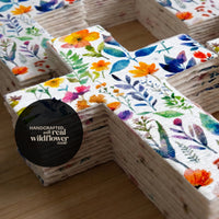 Bloom Cross-Shaped Funeral Favors stacked, handcrafted wildflower seed paper