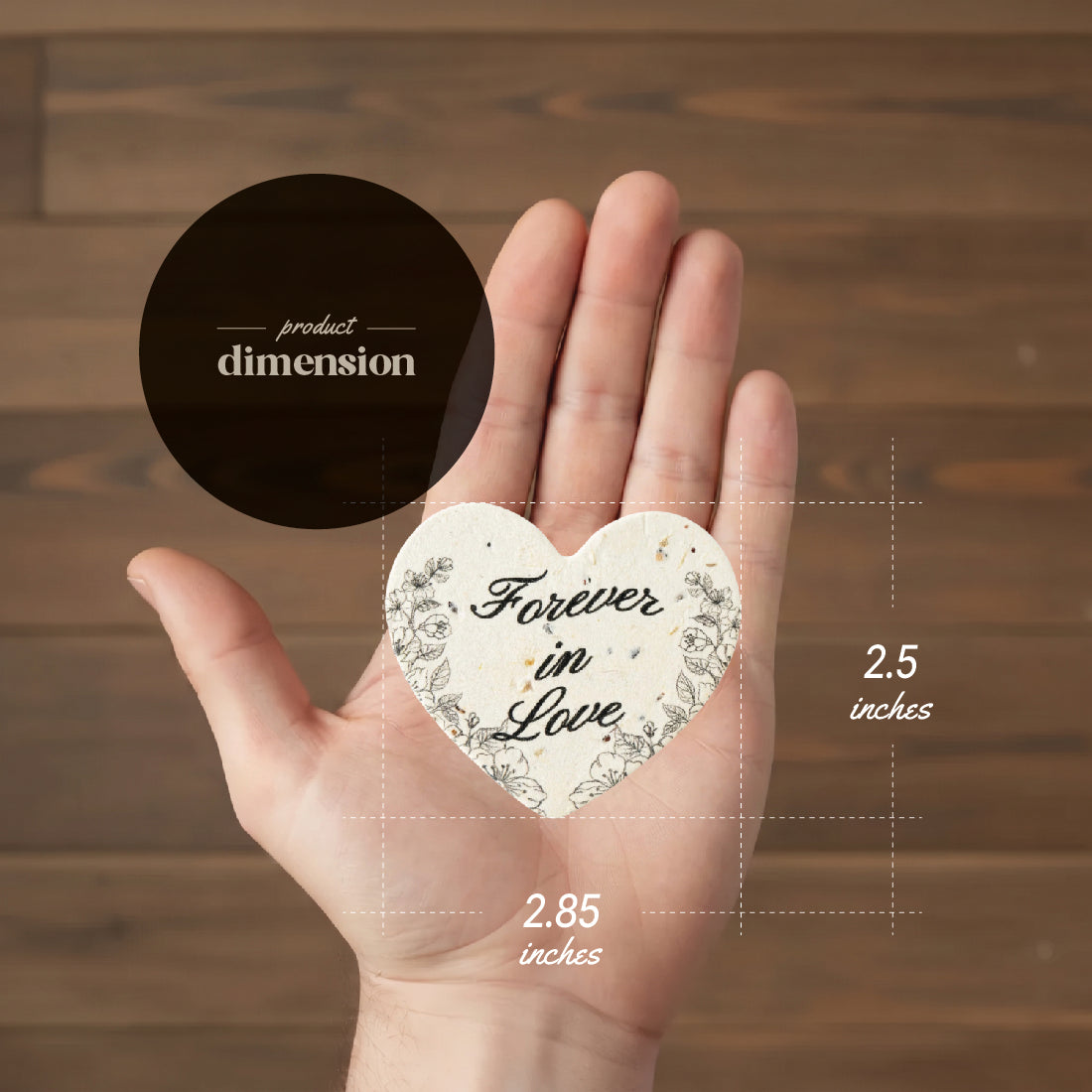 Heart-shaped seed paper 2.5x2.85 inches with Forever in Love text product dimension guide held in hand