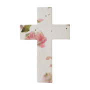 white plantable seed paper cross funeral favor decorated with pressed pink flowers and green leaves