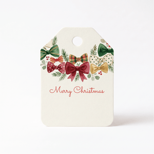 Personalized Merry Christmas gift tag with a garland of burgundy, green, plaid, and polka dot bows with pine sprigs