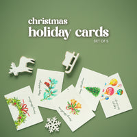 Set of 5 Plantable Holiday Christmas cards by Seed Bloom Gifts with decorative elements on a green background
