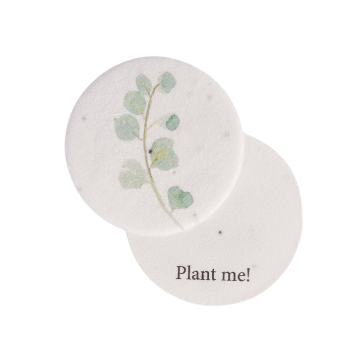 Seed bloom gifts round seed paper with a plantable design and 'Plant me!' text on a white background