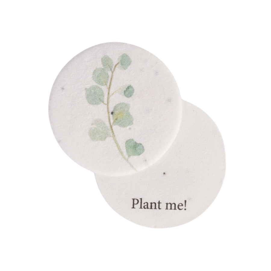 Seed bloom gifts round seed paper with a plantable design and 'Plant me!' text on a white background