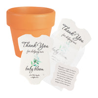 Onesie seed paper baby shower favors with green flowers bundled with orange mini pots and planting guide 