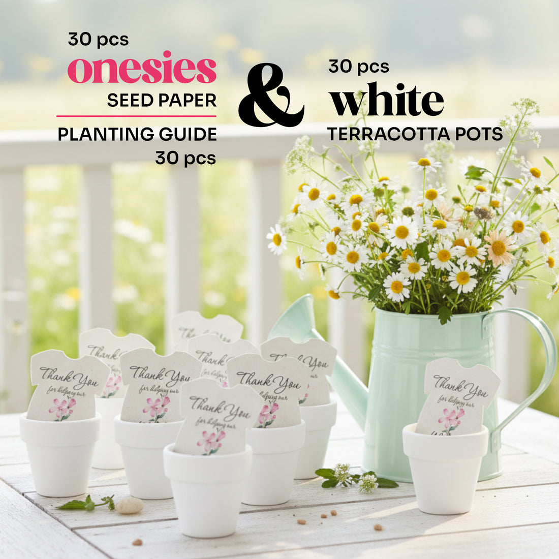 Set of 30 plantable seed paper onesie baby shower favors displayed in white terracotta pots on a wooden table, labeled as including seed paper onesies and a planting guide, with a watering can filled with daisies in the background.